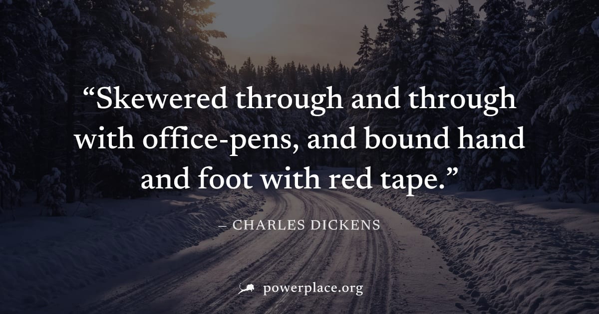 "Skewered through and through with office-pens, and bound hand and foot with red tape." — Charles Dickens